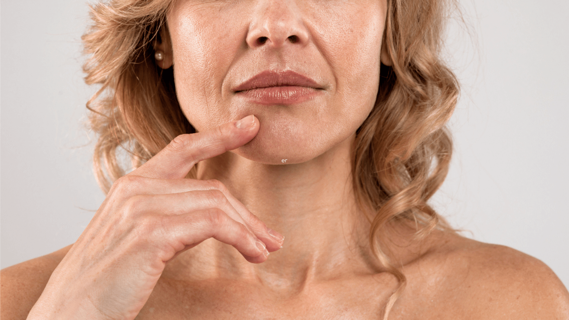 Nasolabial Lines: The Surprising Benefits of Botox close-up of mature woman’s smile lines around mouth and nose