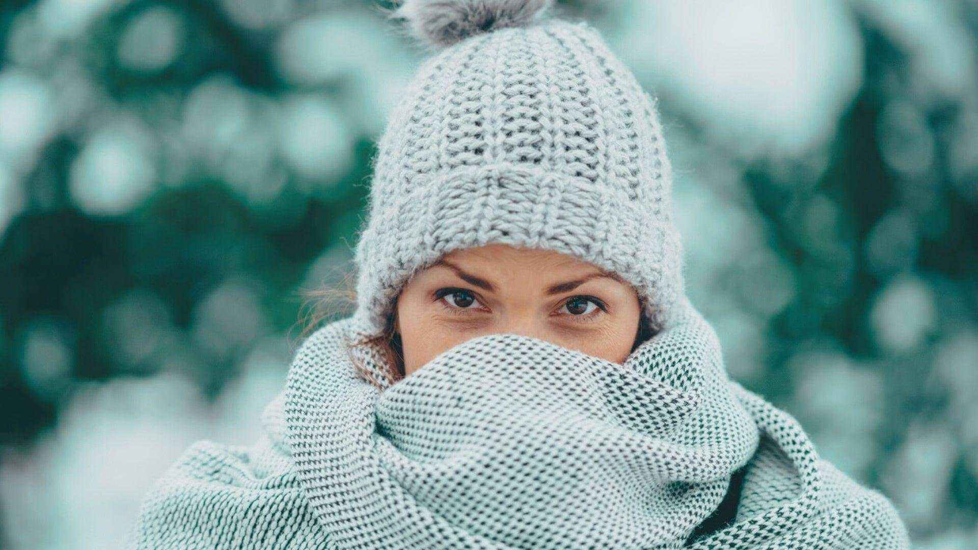 Alt Tag: Seasonal Skincare Routine: How Weather Changes Your Skin (and What I Recommend) winter dryness—person bundled in scarf and knit hat