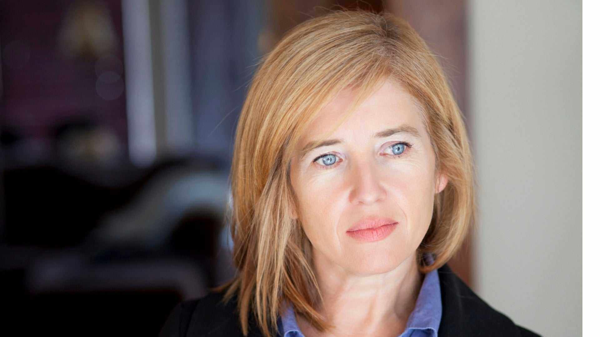 Middle-aged woman looking contemplative, representing brain fog and mood changes during menopause.