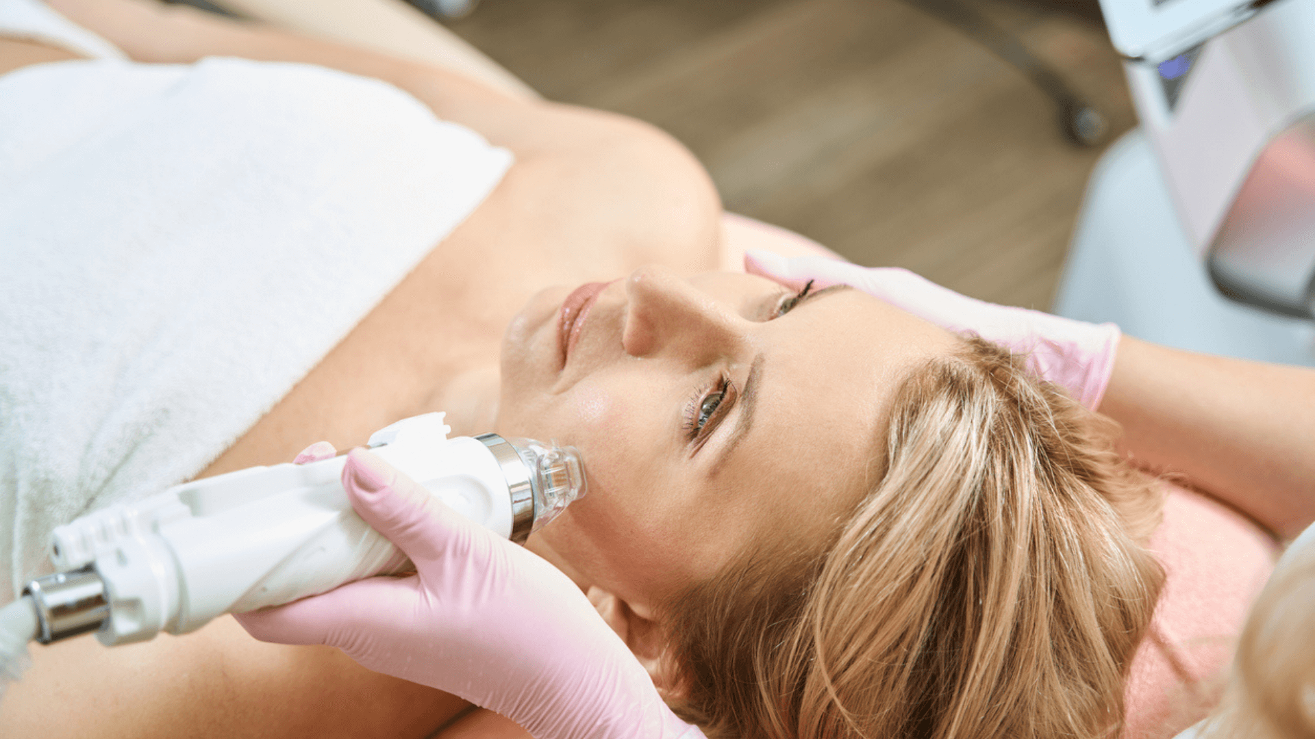 How often can you do Microneedling? (My Doctor’s Guide) clinician performing microneedling treatment on woman’s face in clinic