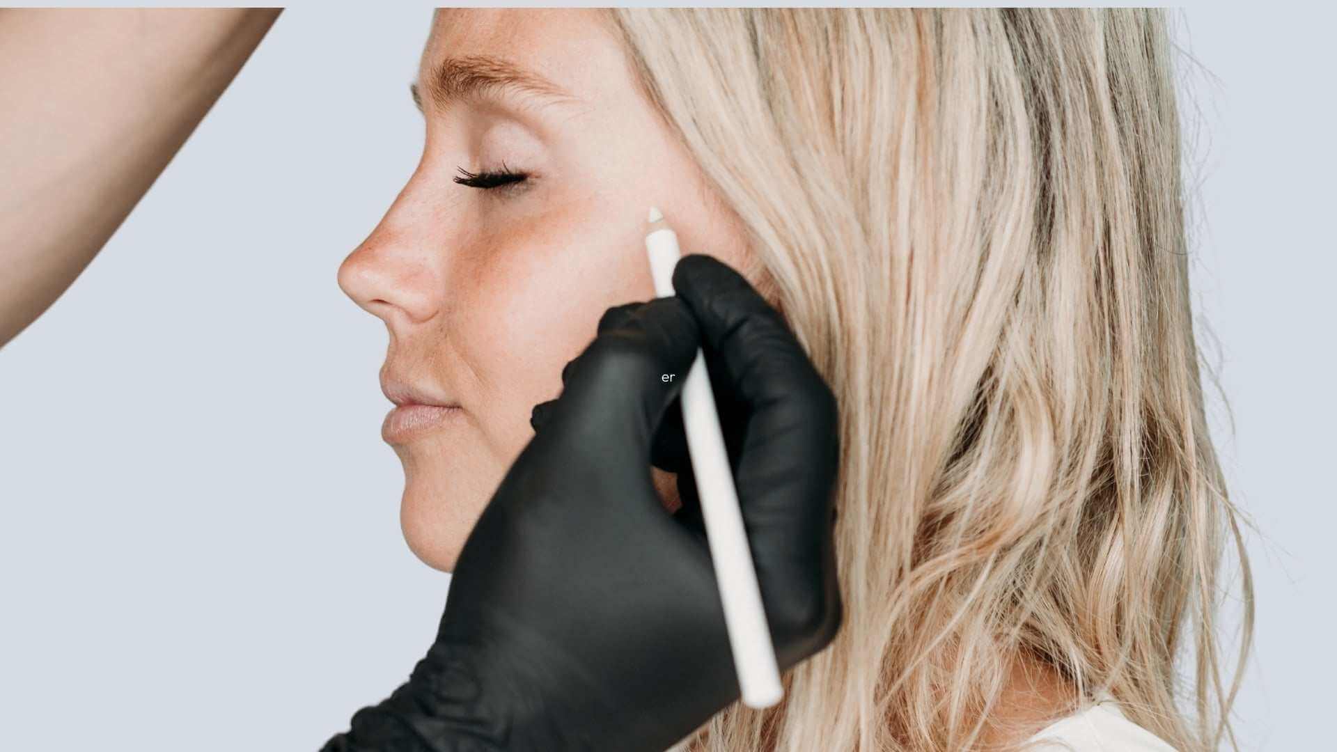Preparing for Your Botox Treatment: Pre-Treatment Instructions - clinician marks injection sites on woman’s face before Botox appointment