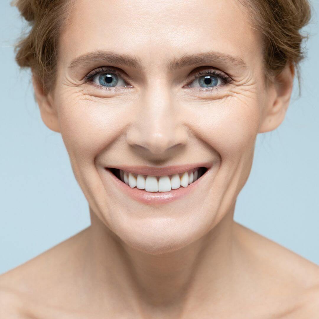 Alt Tag: Eyecare model close-up highlighting smooth under-eye area to target dark circles, puffiness, and fine lines