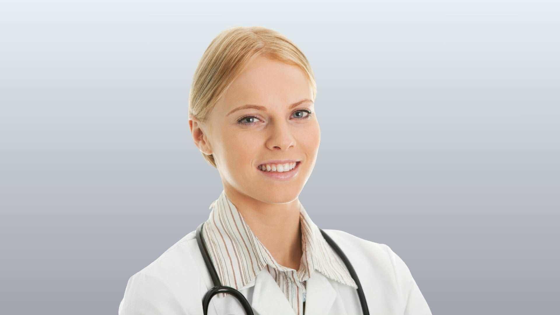 Finding the Best Dermatologist in Oakville - friendly dermatologist portrait in clinic, expert skin care consultation