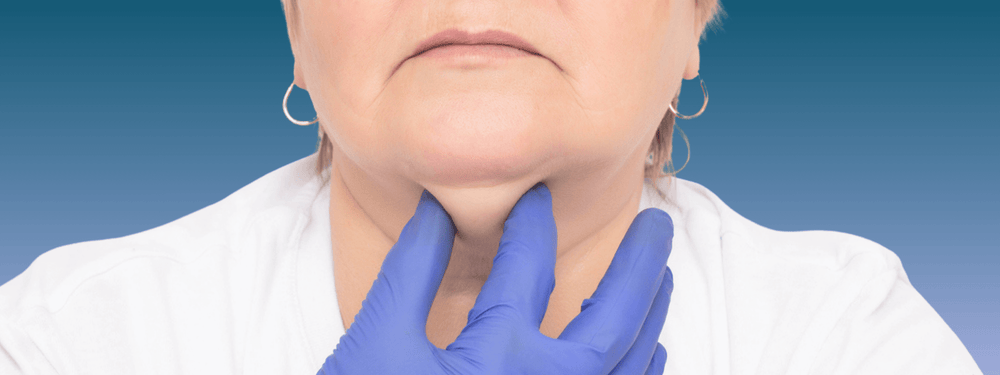 Menopause Fat-Dissolving Injection for Double Chins and Jowls (Belkyra) doctor examining under-chin fat and jowls during consultation