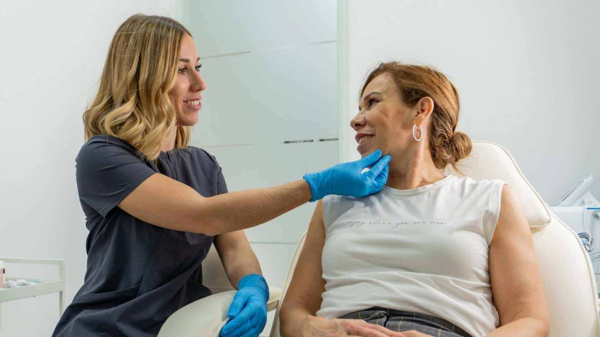 Alt Tag: How Many Units of Botox for Masseter? provider assesses jawline masseter area before Botox injection for clenching and jaw slimming