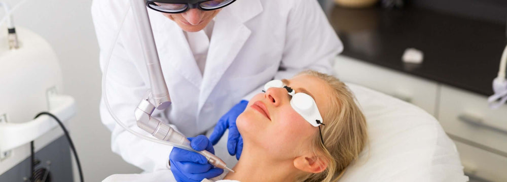 Woman with blonde hair receiving laser treatment