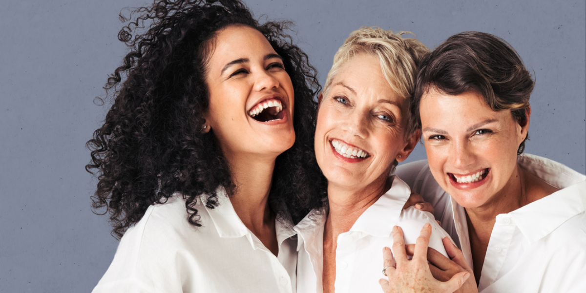 Three mature women laughing cropped